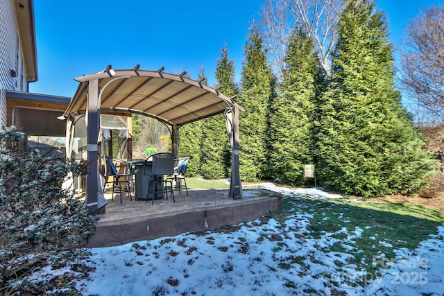 yard covered in snow featuring a bar