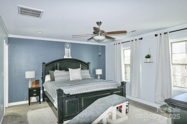 bedroom with crown molding, ceiling fan, carpet, and multiple windows