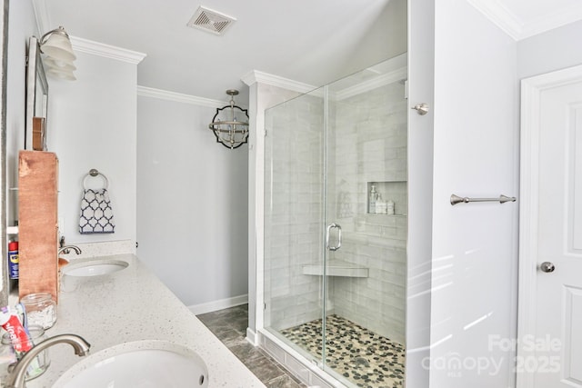 bathroom with ornamental molding, a shower with shower door, and vanity