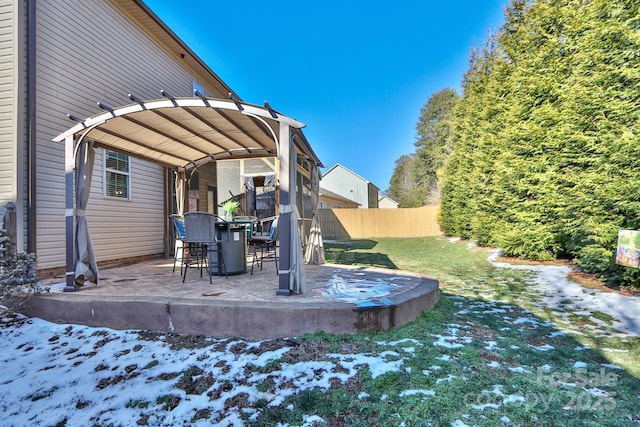 yard covered in snow featuring a pergola