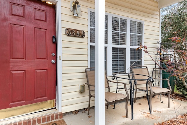 view of exterior entry featuring a porch