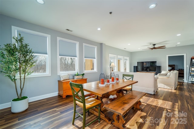 dining room featuring dark hardwood / wood-style flooring and ceiling fan