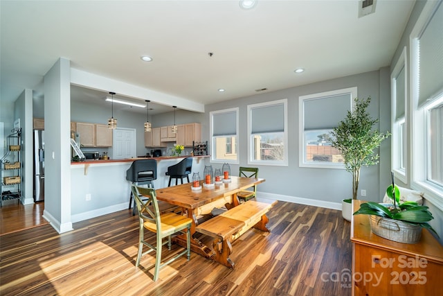 dining space featuring dark hardwood / wood-style floors