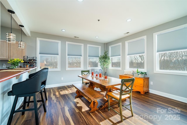 dining area with dark wood-type flooring