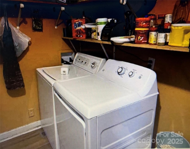 clothes washing area featuring washing machine and dryer