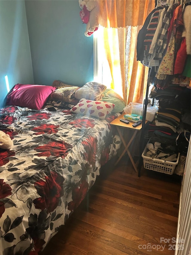 bedroom with wood-type flooring