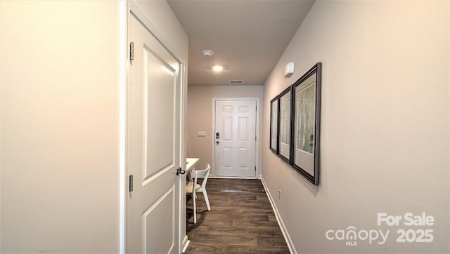 corridor featuring dark wood-type flooring