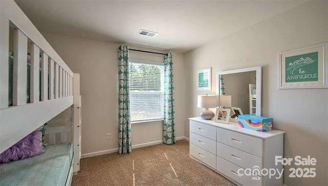 bedroom featuring light colored carpet