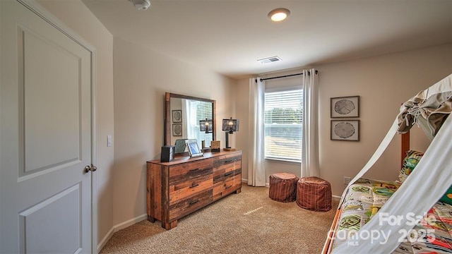 bedroom featuring light carpet