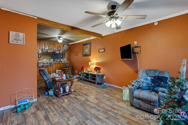 living room featuring hardwood / wood-style flooring and ornamental molding