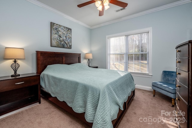 carpeted bedroom featuring ceiling fan and ornamental molding