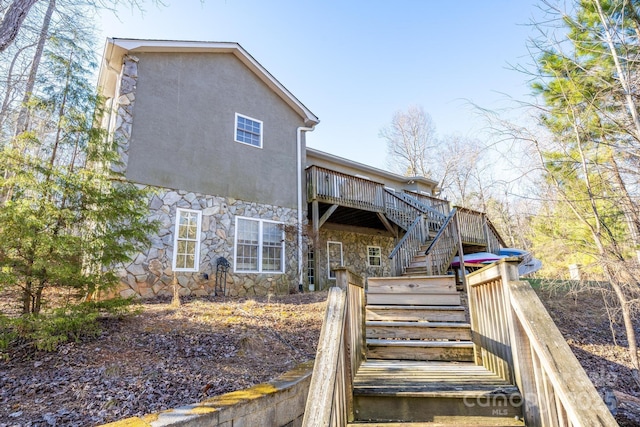 back of property with a wooden deck