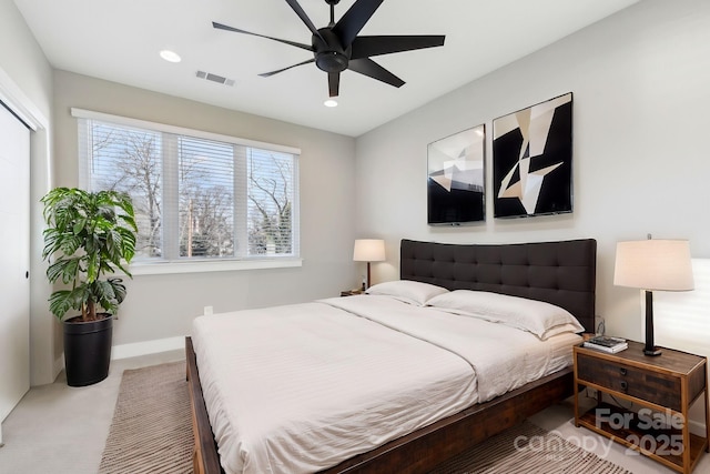 bedroom featuring ceiling fan and multiple windows