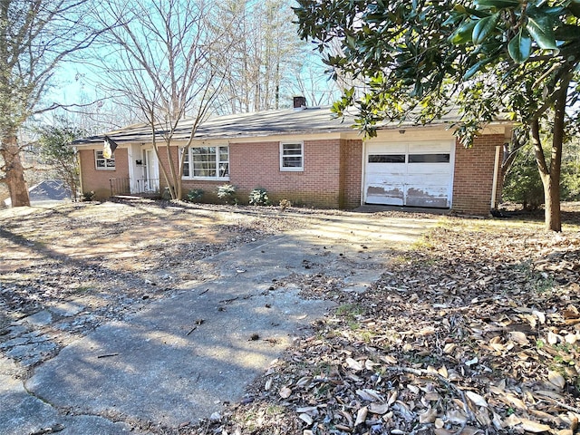 single story home featuring a garage