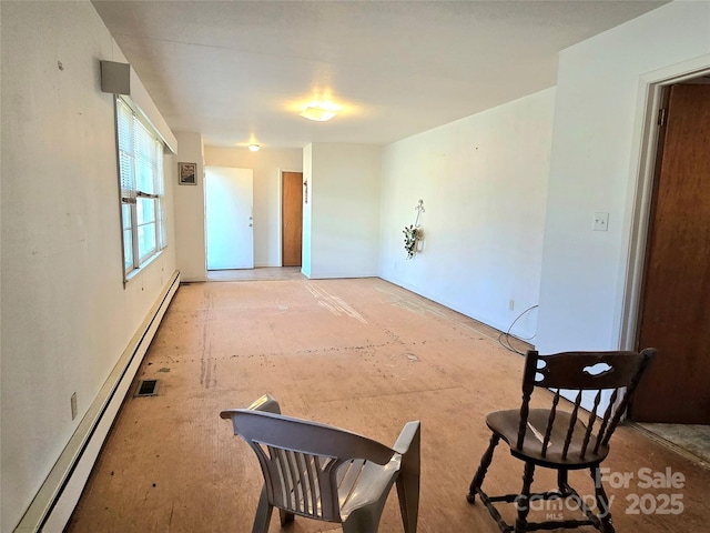 unfurnished room featuring a baseboard radiator