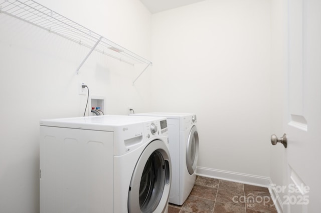 washroom with washer and clothes dryer