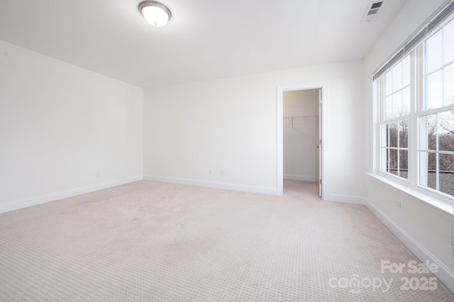 spare room with light carpet