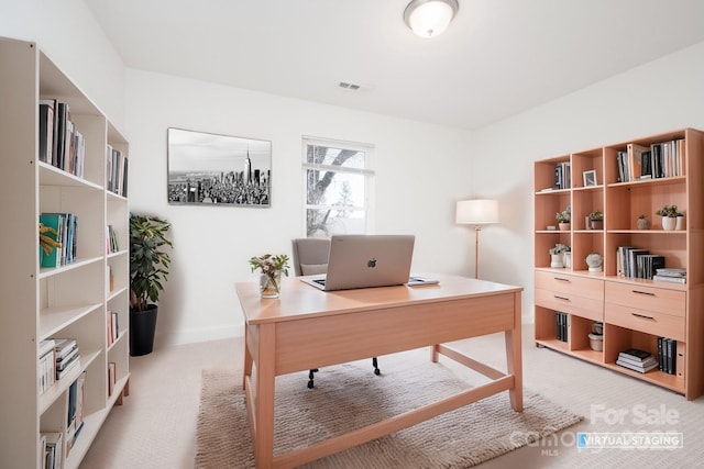 office space featuring light carpet