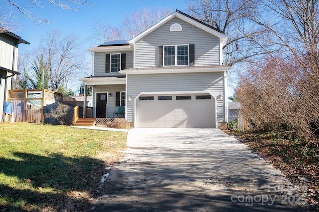 front facade with a front yard, a garage, a porch, and solar panels