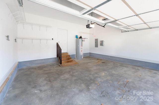 garage featuring electric panel, water heater, and a garage door opener