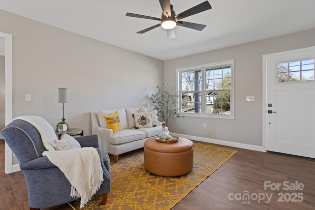 living room with dark hardwood / wood-style floors and ceiling fan