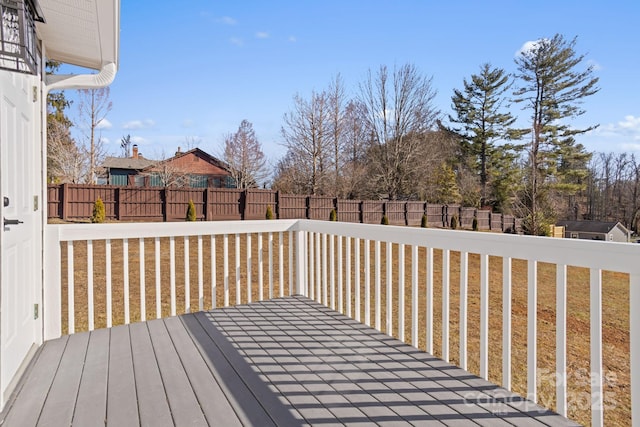 wooden deck with a yard