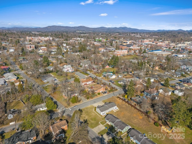 birds eye view of property featuring a mountain view