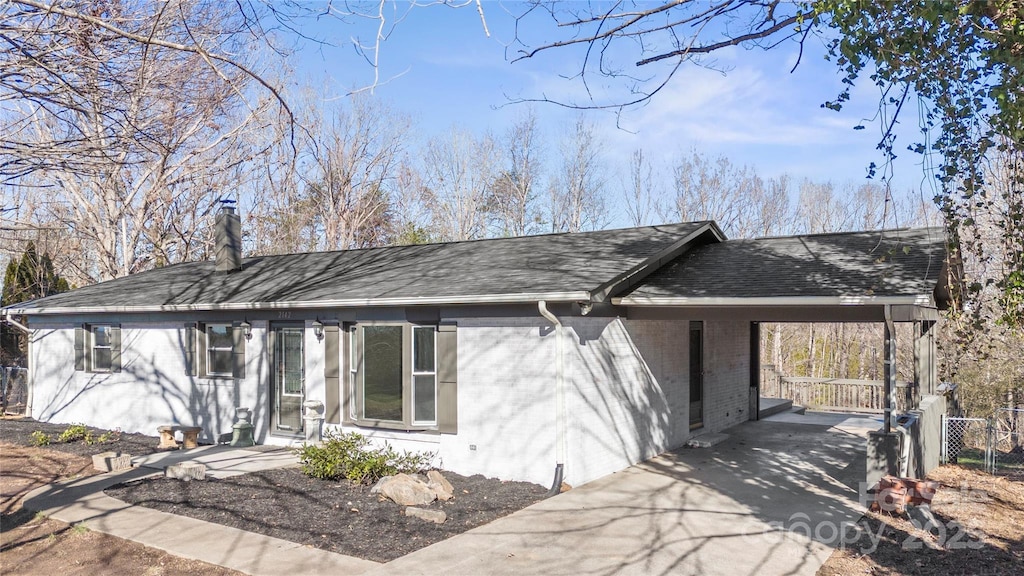 ranch-style house with a carport