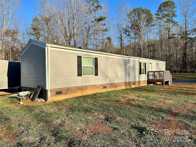 view of side of property with a yard