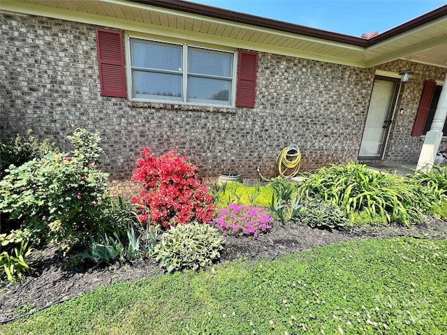 property entrance featuring brick siding