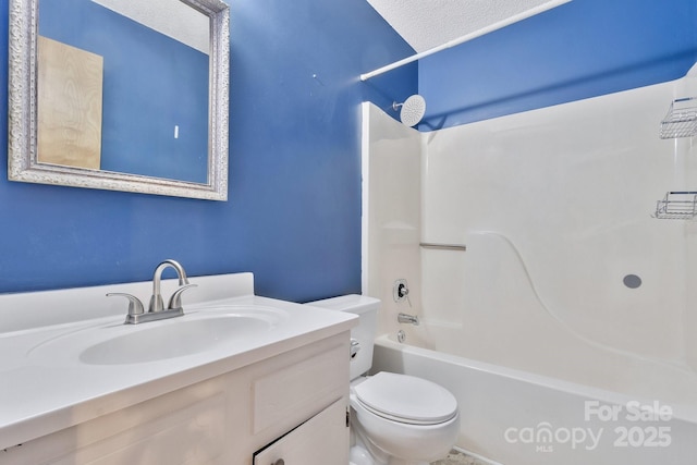 bathroom with toilet,  shower combination, and vanity