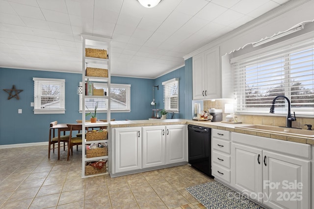 kitchen featuring sink, white cabinets, ornamental molding, and black dishwasher