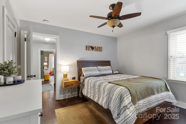 bedroom featuring ceiling fan and dark hardwood / wood-style floors