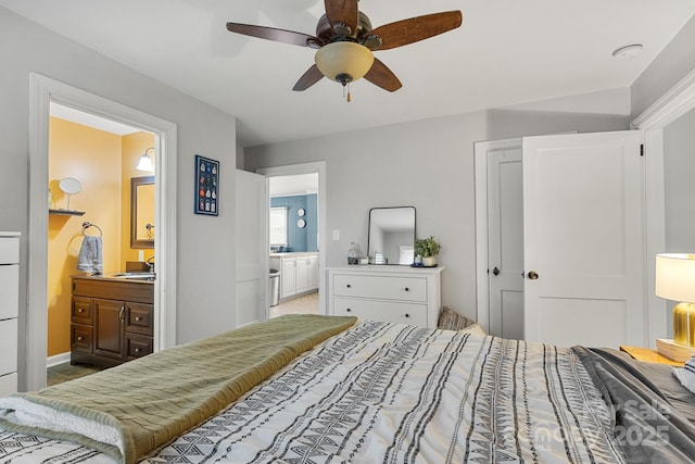 bedroom with ensuite bathroom, ceiling fan, and sink