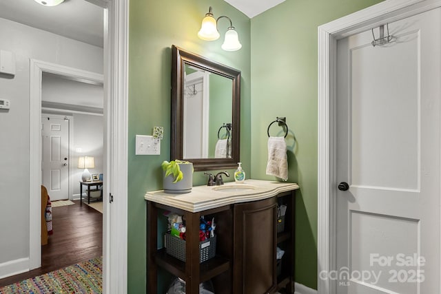 bathroom featuring vanity and wood-type flooring