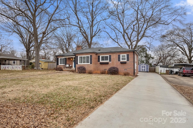 view of front of home with a shed and a front yard