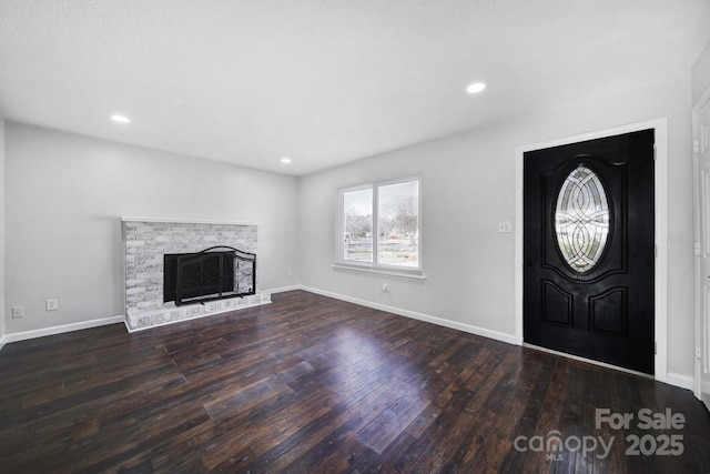 foyer entrance with dark hardwood / wood-style floors