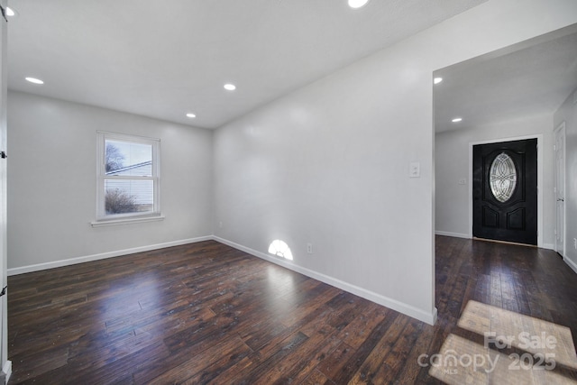 foyer entrance featuring dark hardwood / wood-style floors