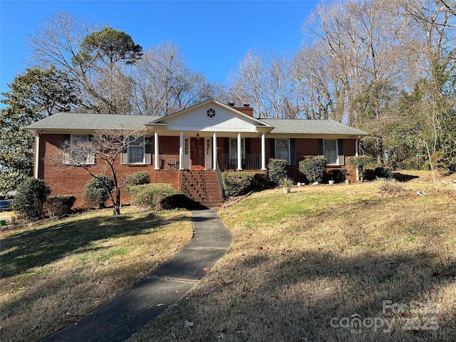 single story home with a front lawn and a porch