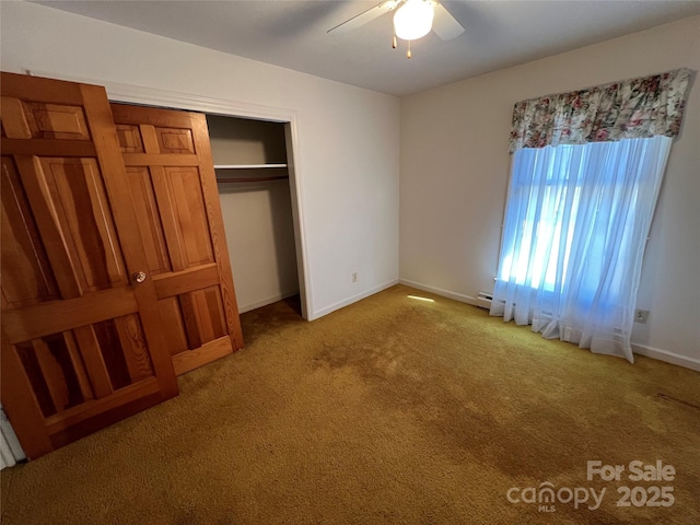 unfurnished bedroom with a closet, ceiling fan, and light colored carpet