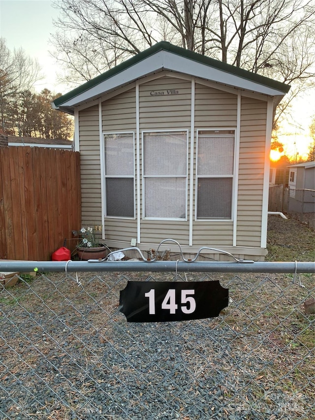 view of property exterior at dusk