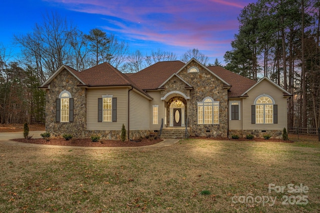 ranch-style house with a lawn