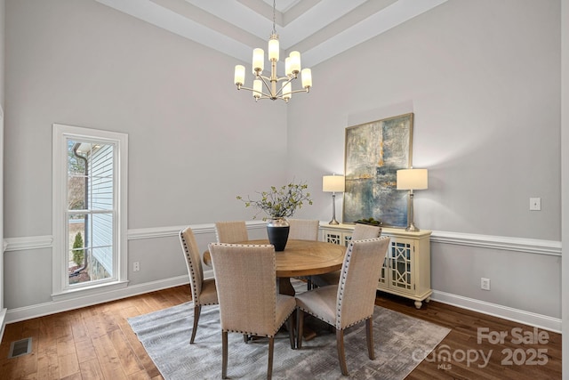 dining room featuring a chandelier and hardwood / wood-style floors