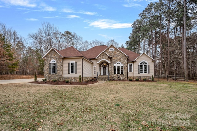 single story home featuring a front yard