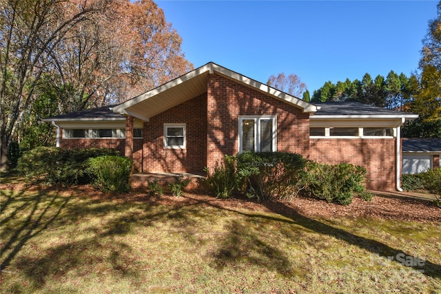 view of home's exterior with a yard