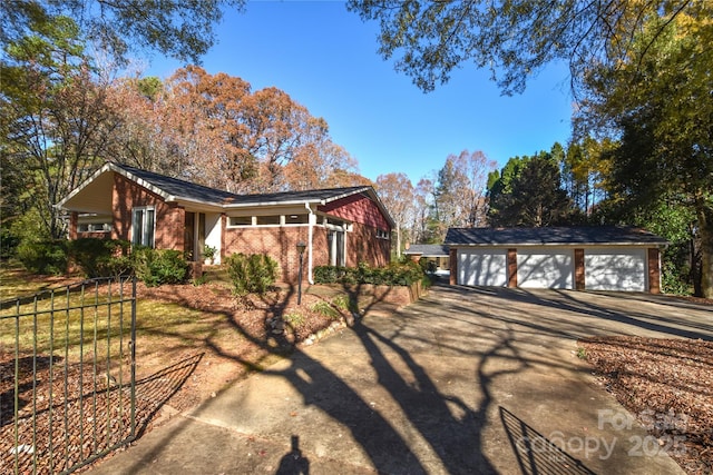 view of side of property with an outbuilding and a garage