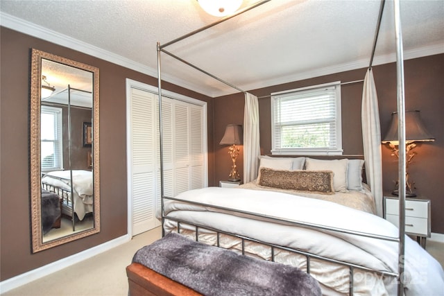 carpeted bedroom with a closet, a textured ceiling, and ornamental molding