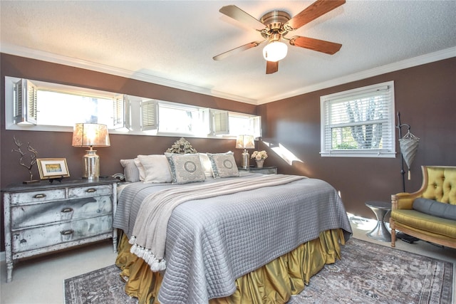 bedroom featuring a textured ceiling, ceiling fan, and ornamental molding