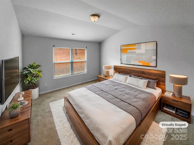 carpeted bedroom featuring lofted ceiling