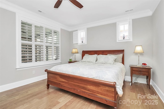 bedroom with ornamental molding, light hardwood / wood-style floors, and ceiling fan